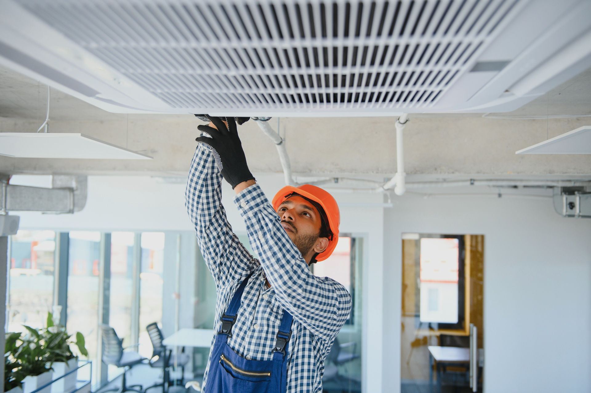 Technician installing an air conditioner